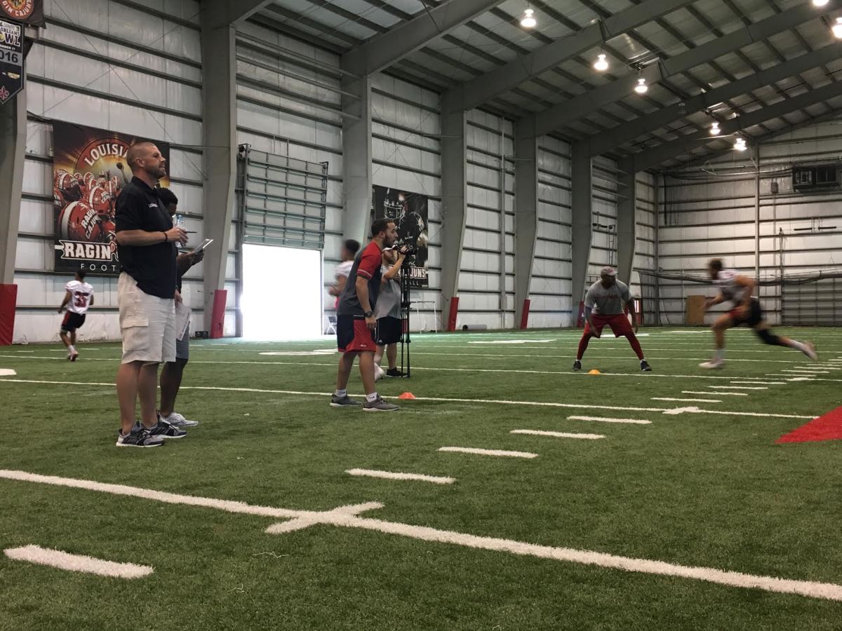 Billy Napier watches walk-ons participate in workouts inside Louisiana’s indoor facility.